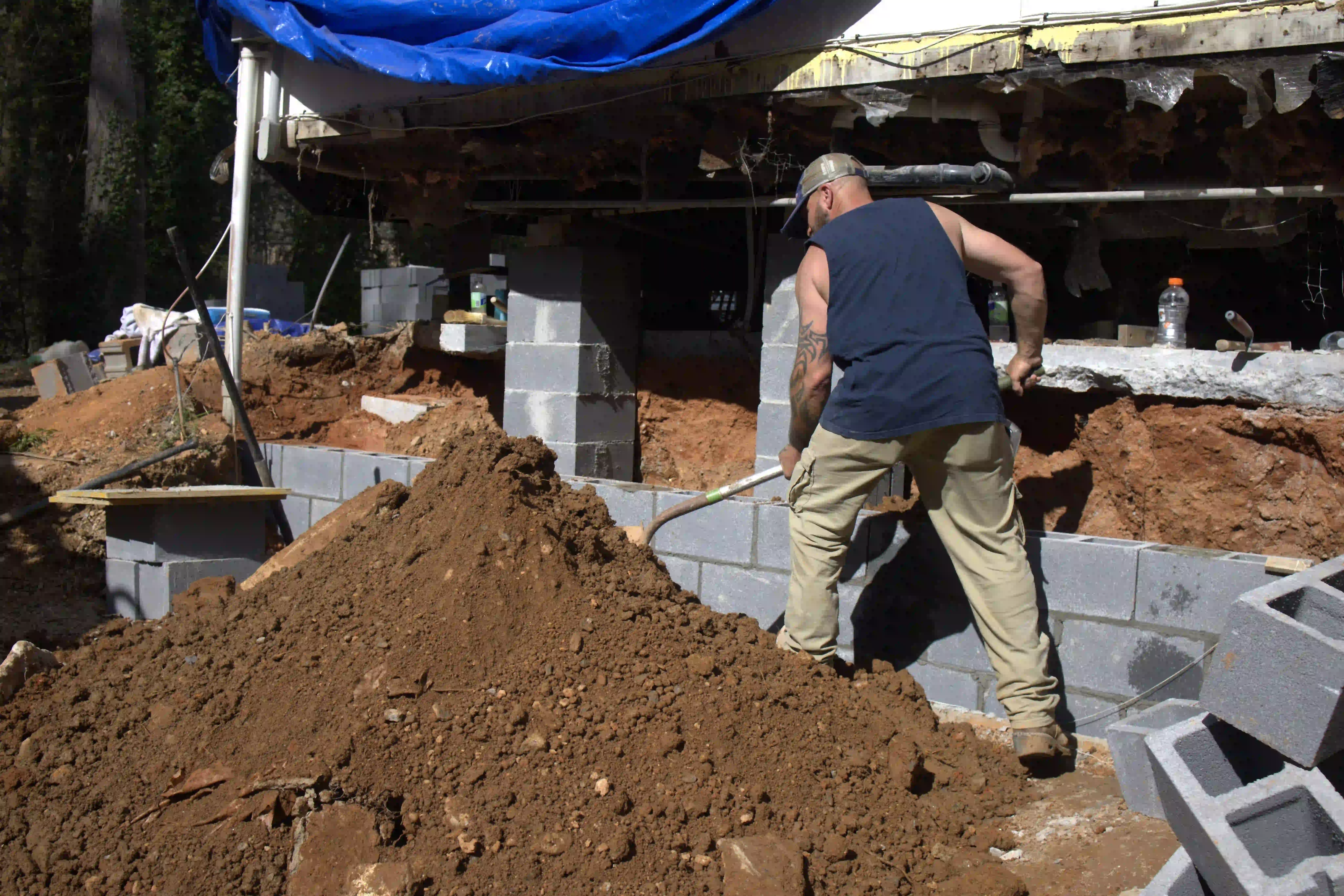 Licensed general contractor in Alpharetta GA reviewing building plans for local code compliance